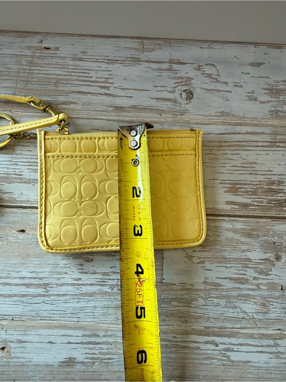Coach wristlet Buttercup Yellow Signature Embossed Wristlet NWT